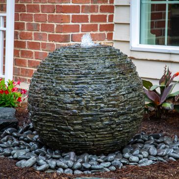Stacked Slate sphere with basic surrounding landscaping