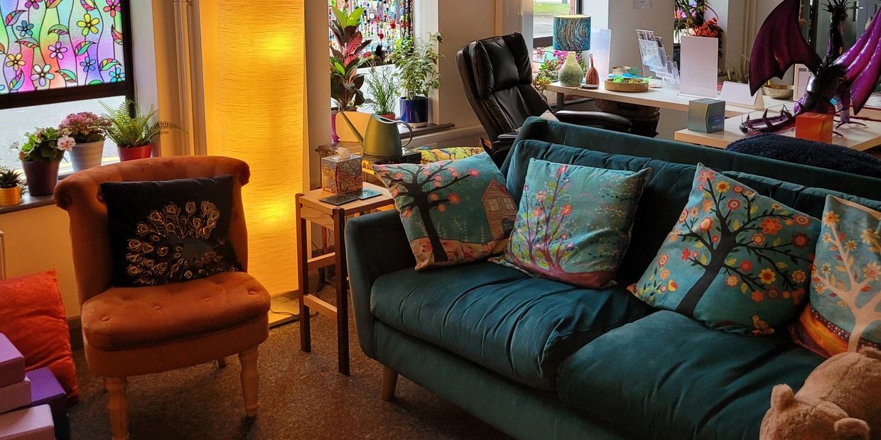 Colourful room with comfy chairs and cushions