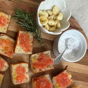 Pan con tomat with garlic, rosemary, Spanish olive oil, and salt