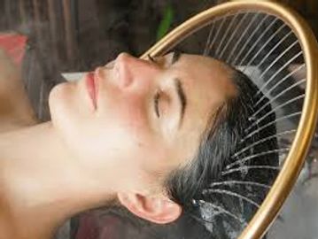 Woman enjoying a relaxing water therapy treatment.