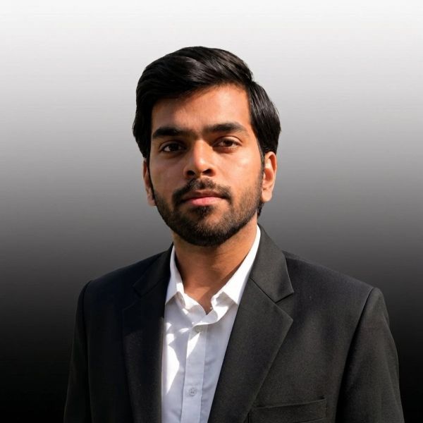 Young man in a black suit and white shirt.