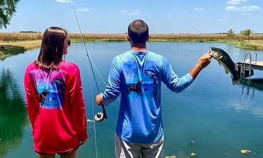 A man and a woman fishing together