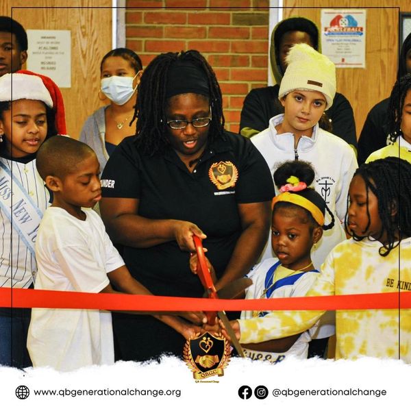 young cutting ribbon