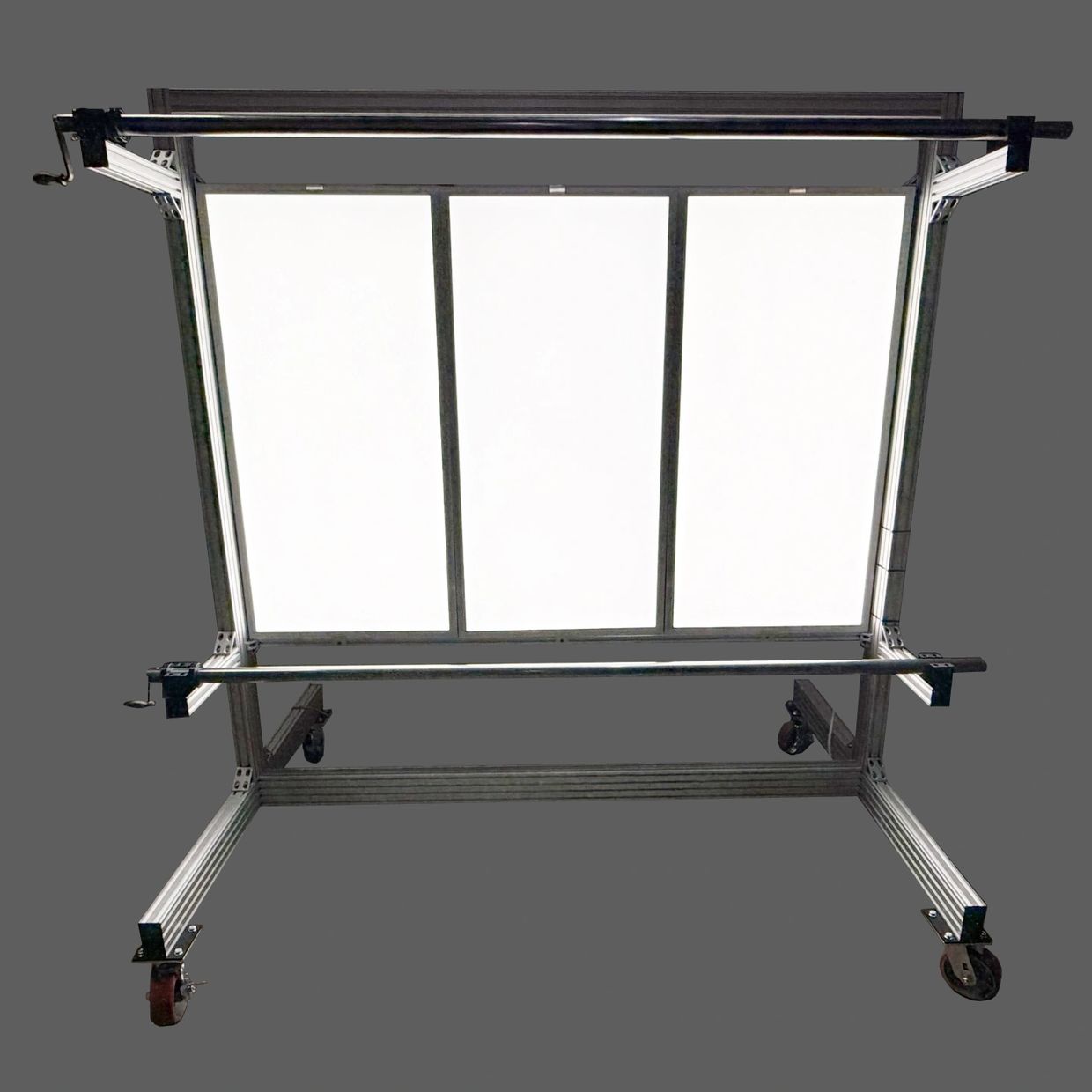 Adjustable rolling light panel with crank handles and white translucent surface.