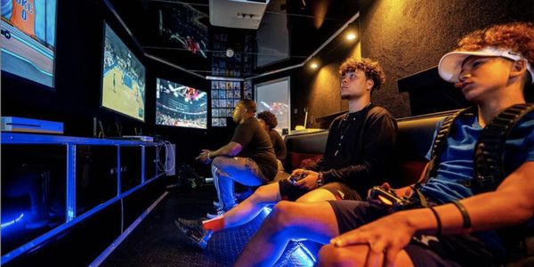 two youngsters playing games at rolling video games of will county
