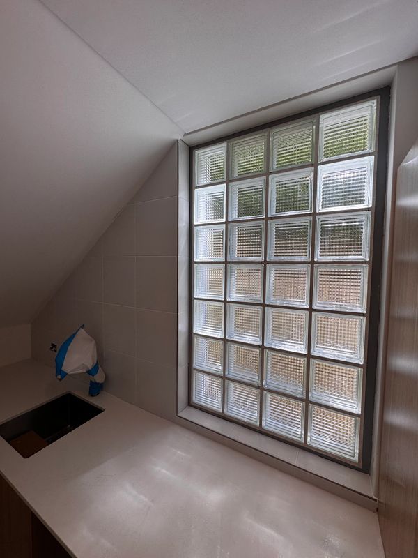 Window with glass blocks in a clean kitchen corner.