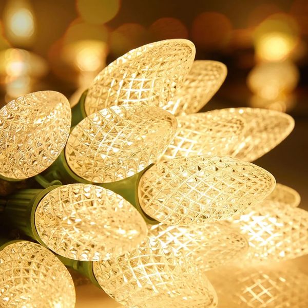 Close-up of warm white LED holiday lighting with textured bulbs.