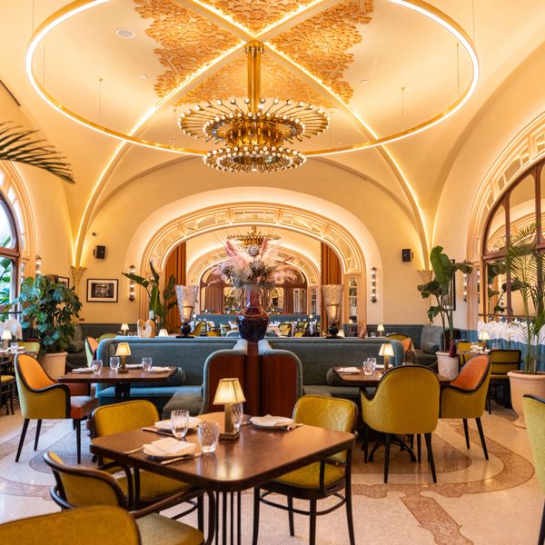 Elegant restaurant interior with warm lighting and stylish seating.