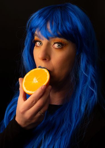 Beautiful model holding orange