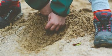 Child playing in sand