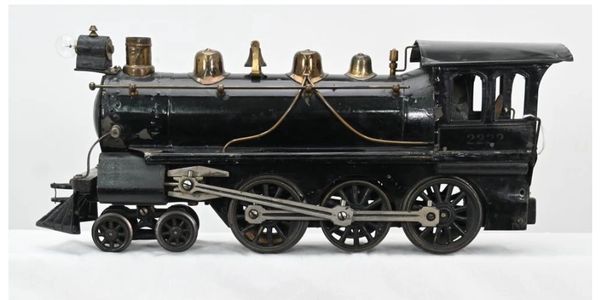 Vintage black toy train engine and coal car with B&O logo.