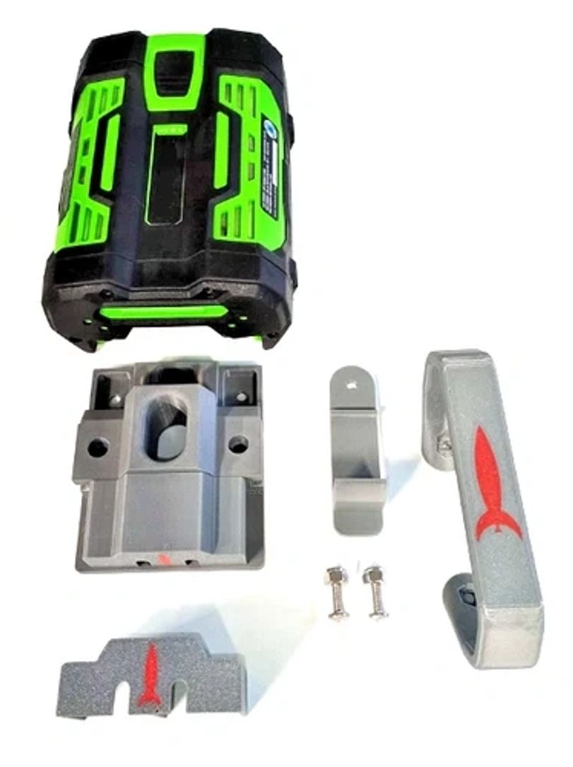 Green and black laser level with mounting accessories.
