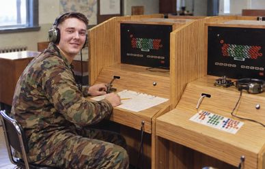 Soldier working at a language training station.