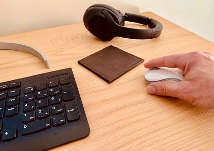 Man clicking a mouse plus keyboard searching for content
