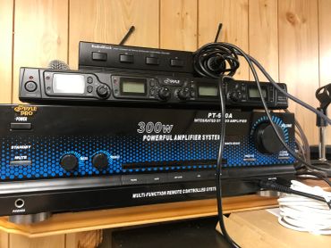 Powerful 300W amplifier system with remote control and audio equipment.