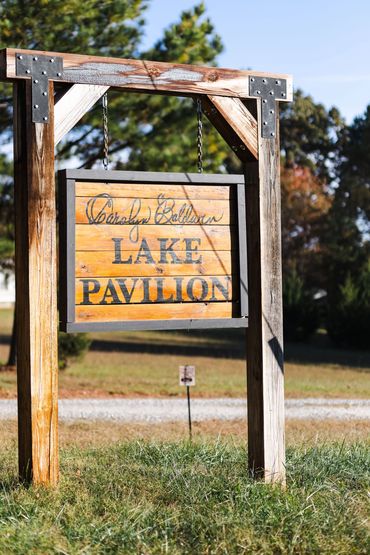 Wooden wedding venue entrance sign for affordable waterfront wedding venue in Virginia