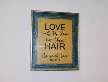 Framed decorative sign about hair love.