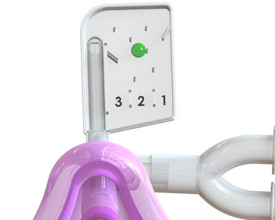 A white plastic device with a green ball and numbers 3, 2, 1.