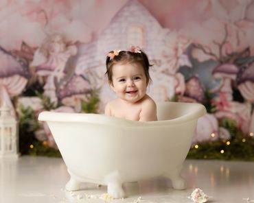 Cake Smash bath fairy session of happy baby during her studio session in Riverside ca with best tog.