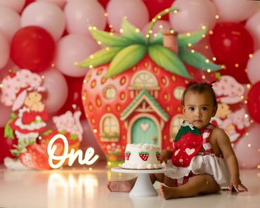 Berry first birthday cakesmash  with  girl eating cake during her studio session in riverside, ca.