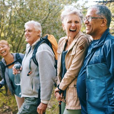 two couples hiking and laughing 