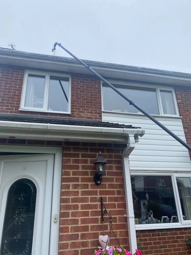 gutter cleaning at front of property 