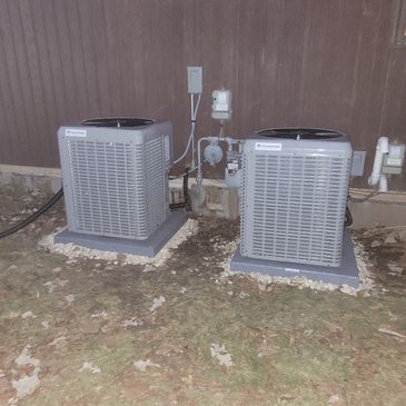 two air conditioning units at night