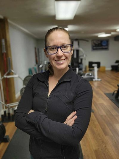 A girl smiling in a gym