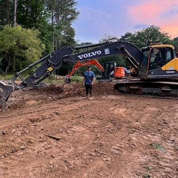 Excavating contractor in Birmingham clearing land on residential lot.