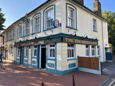 The Theobald Arms pub on a sunny day.