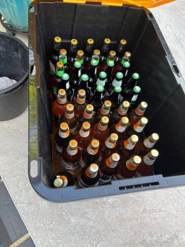 A large container filled with assorted bottled beers.