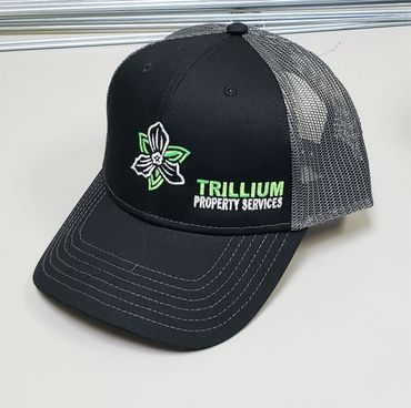 Black and gray mesh cap with Trillium Property Services logo.