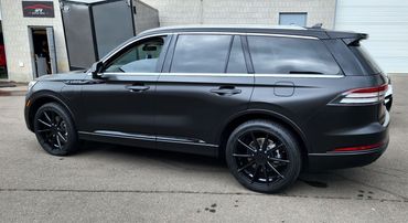 Lincoln Aviator wrapped from blue to satin black.