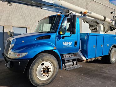 International truck and service body wrapped from white to metallic blue.