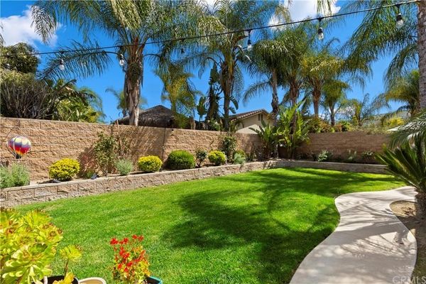 landscaped yard with flowers and trees