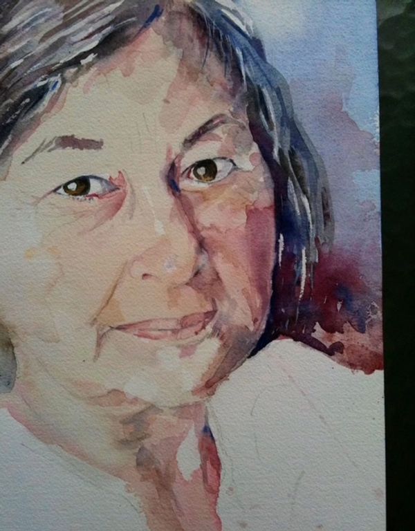 Watercolor portrait of a smiling elderly woman with expressive eyes.