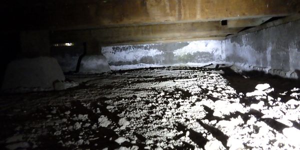 Crawlspace with efflorescence on foundation/stem walls