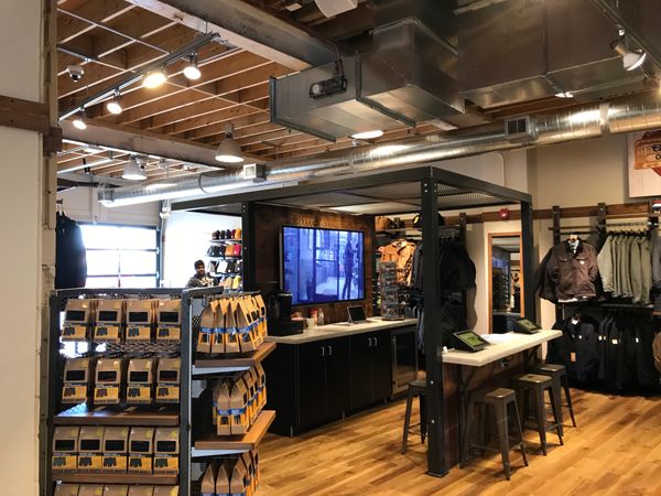 Modern retail store interior with clothing and accessories.