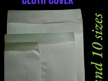 Three white cloth covers of different sizes displayed on a black background.