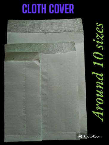 Three white cloth covers of different sizes displayed on a black background.