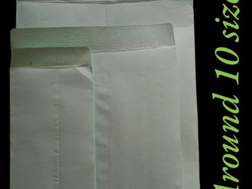 Three white envelopes of different sizes arranged overlapping each other.