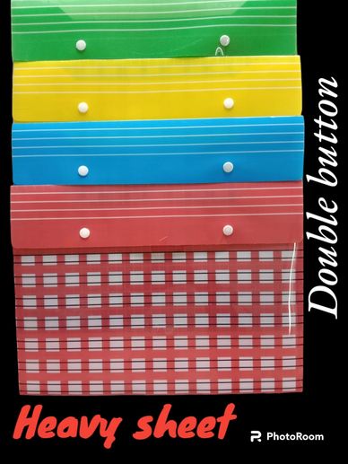 Stack of colorful plastic folders with double buttons labeled 'Heavy sheet'.