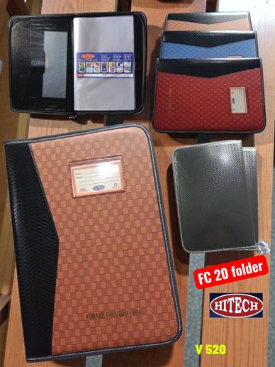 Various office folders and document holders displayed on a wooden surface.