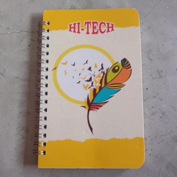 Spiral notebook with colorful feather and bird design on cover.