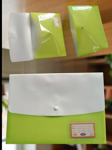 Green and white plastic document folders with snap buttons are shown.