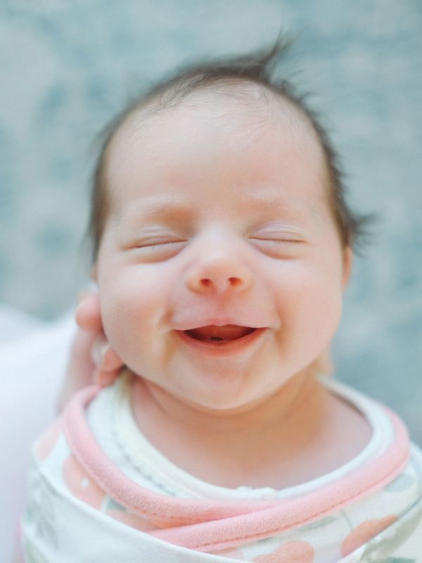 baby sleeping and smiling after eating nursing 