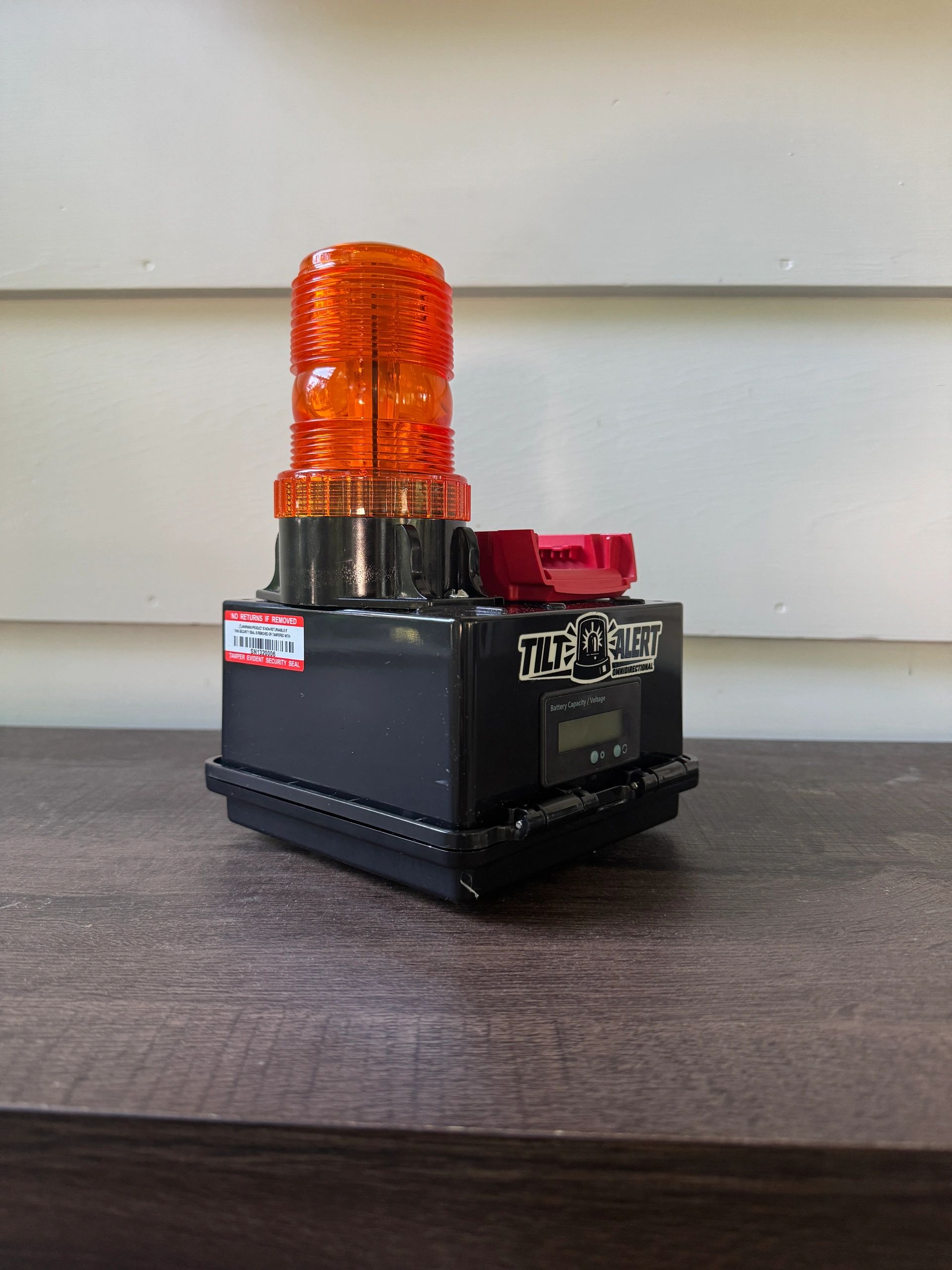 Tilt Alert warning light device on a table.