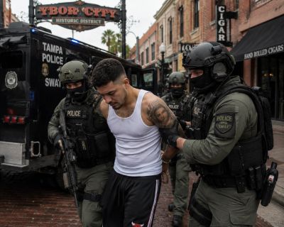 SWAT officers arresting a young man in Tampa's historic district.