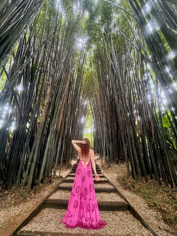psychic medium Leanne Zaccar visits crystal castle in a flowy pink dress