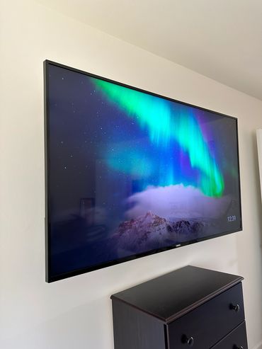 55" TV mounted on drywall